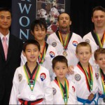 [2009 NSW State Championships] Back row: G.Master Kwon, Zi-hao (Sparring & Poomsae - GOLD), James (Sparring - Bronze, Poomsae - GOLD), Andrew (Sparring & Poomsae - GOLD) / Front row: Joonhwy (Sparring - GOLD), Joonhwa (Sparring - Silver), Jack (Sparring & Poomsae - Bronze), Emlyn (Sparring - Silver)